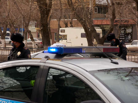 patrol officers check cars and documents with drivers during quarantine.のeditorial素材
