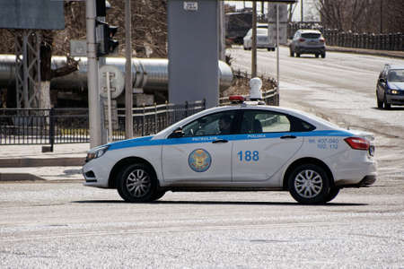Karaganda/Kazakhstan police patrol car rides on a city street