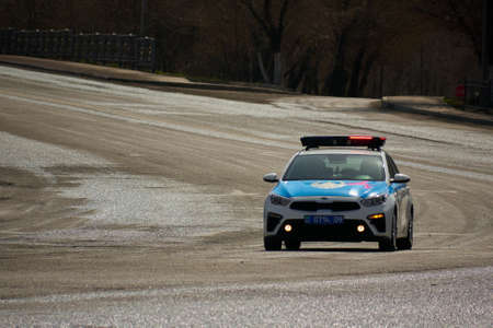 Karaganda/Kazakhstan police patrol car rides on a city streetのeditorial素材