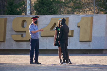 Karaganda, Kazakhstan - 22.04.2020: patrol officers and talk to the quarantine violatorsのeditorial素材