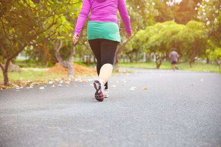 Women exercising. Runner woman running in the morning at the public park.