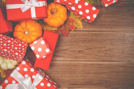Top view of Thanksgiving concepts on wood background, Pumpkins, leaves and gift boxes, Copy space...