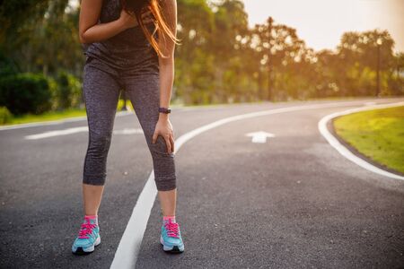 Female runner athlete chest injury and pain. Woman suffering from painful chest or Symptoms of heart...