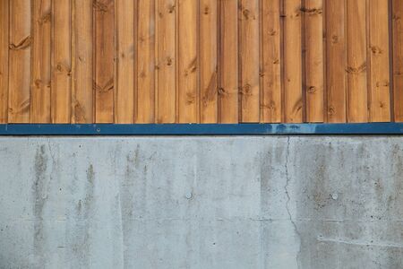 Old brown wooden wall, detailed background photo texture. Wood plank fence close up and grunge cement floor texture background.の写真素材
