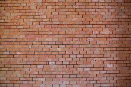 Old red brick wall texture grunge background with vignetted corners, may use to interior design.の写真素材