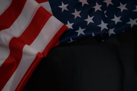 Close up of waving national usa american flag on black background with copy space for text. Concept...