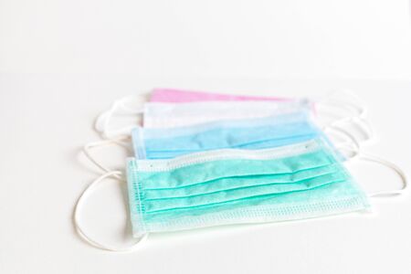 Coronavirus COVID-19 pandemic. Antiviral medical mask for protection against corona virus. Surgical protective mask. Medical respiratory bandage face on white background. quarantine, stay at homeの写真素材