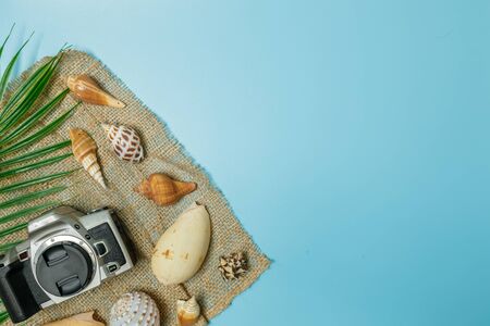 The beach accessories on the blue background. Summer is coming concept. vacation and travel concept. copy space.の写真素材
