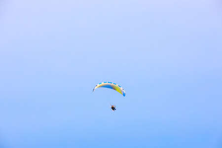PATTAYA/CHONBURI/THAILAND - JUNE 13 2020: Man flying paramotor in the sky, Extreme sport paramotor flying. Pattaya Chonburi, Thailand.のeditorial素材