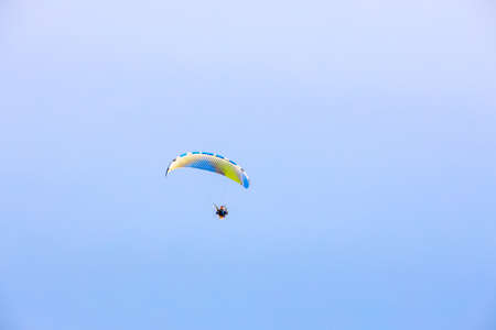 PATTAYA/CHONBURI/THAILAND - JUNE 13 2020: Man flying paramotor in the sky, Extreme sport paramotor flying. Pattaya Chonburi, Thailand.のeditorial素材