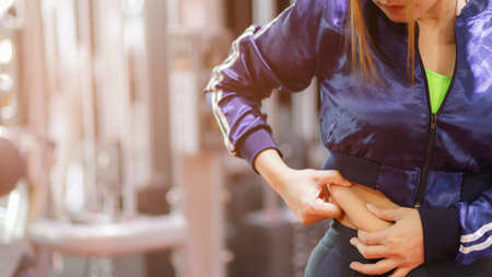 Fat women exercising. Young fitness woman exercising in the gym before fitness and exercise.