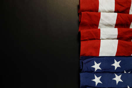 Close up of waving national usa american flag on black background with copy space for text.の写真素材