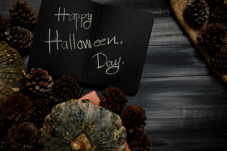 Fall Thanksgiving and Halloween pumpkins, leaves, acorn squash over dark wood table background shot from directly above.の写真素材