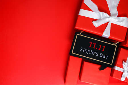 Online shopping of China, 11.11 single's day sale concept. The red gift boxes on red background with...