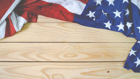 Close up of waving national usa american flag. The flag of the United Sates of America on a grey plank background with memorial day.の写真素材