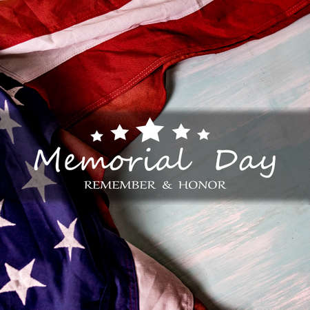Close up of waving national usa american flag. The flag of the United Sates of America on a grey plank background with memorial day.の写真素材