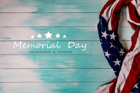 Close up of waving national usa american flag. The flag of the United Sates of America on a grey plank background with memorial day.の写真素材