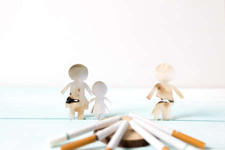 Paper cut of family destroyed by cigarettes. Drugs destroying family concept. Quit smoking for life on World no Tobacco day concept. World no tobacco day.の写真素材