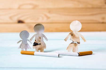 Paper cut of family destroyed by cigarettes. Drugs destroying family concept. Quit smoking for life on World no Tobacco day concept. World no tobacco day.の写真素材