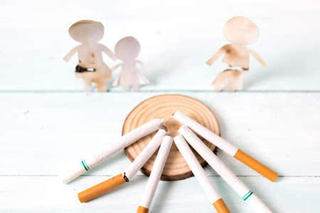 Paper cut of family destroyed by cigarettes. Drugs destroying family concept. Quit smoking for life on World no Tobacco day concept. World no tobacco day.の写真素材