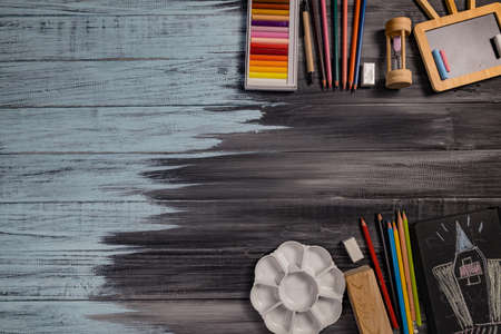 School supplies on black board background. Back to school concept.の写真素材