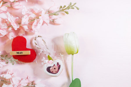 Everyday is mother's day. Mother's day concepts and Sweetest day, love concept. Red heart with the letter LOVE MOM with Beautiful flower on pink background.の写真素材
