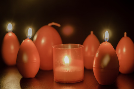 red easter egg shape candle burningの写真素材