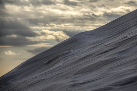 drifts from snow after a snowfall. Snow dunes.The surface is not levelの写真素材
