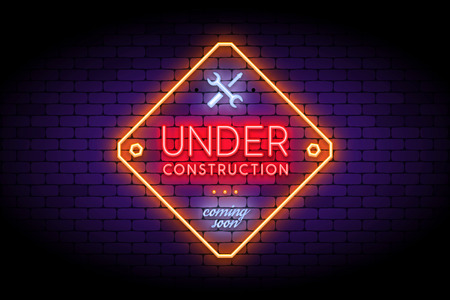 Under Construction sign in trendy neon style on the brick wall. Realistic neon effect for temporary site page. Vector illustration.のイラスト素材