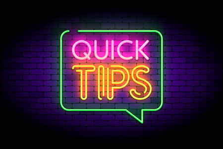 Quick tips, hint, helpful tricks in speech bubble with neon effect. Vector illustration on dark brick background.のイラスト素材