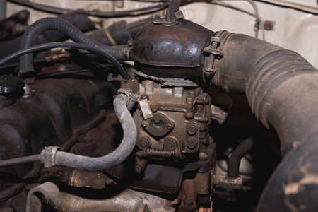 old engine in a used car. Carburetor for the fuel supply to the engine