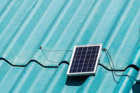Solar cell, small panel installed on the roof of the house It is an alternative energy. Solar panel. solar powerの写真素材