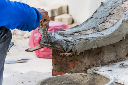 Construction work Construction worker working in the sun during the day Construction work, Brick...