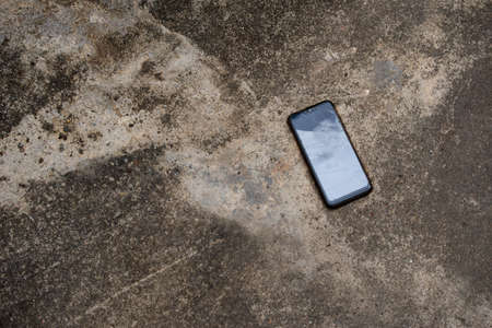 smartphone fell to the ground causing the screen to crack.の写真素材