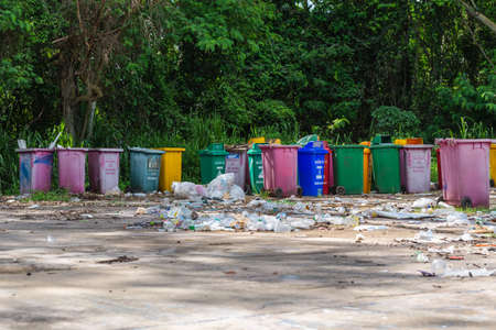 Many plastic bins were left in the garbage collection area. polluteの写真素材