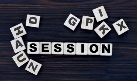 concept word session on cubes on a dark wooden background with lettersの写真素材