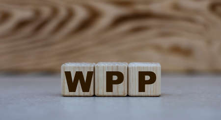 concept of the word WPP on cubes on a gray background with lettersの写真素材