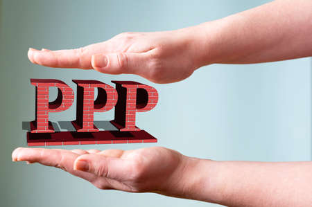 Female hands hold the acronym PPP on a light background. Technology conceptの写真素材