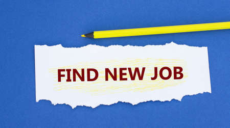FIND NEW JOB - word on a torn white paper on a blue background. Info conceptの写真素材