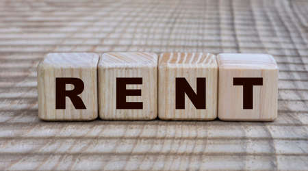 concept of the word RENT on cubes on a beautiful background. Business concept.の写真素材