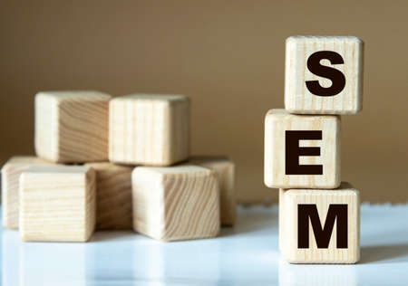 SEM (Search Engine Marketing) - acronym nadrevyannye cubes on a brown backgroundの写真素材