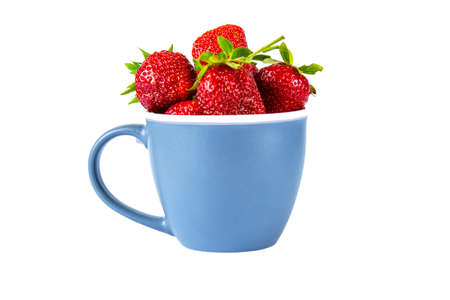 Red strawberries in a blue cup isolated on a white backgroundの写真素材