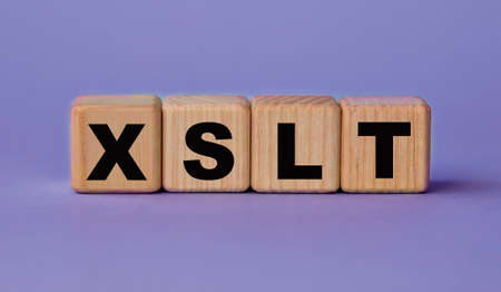 XSLT (Extensible Stylesheet Language Transformations) - acronym on wooden cubes on a lilac...
