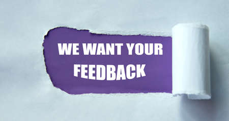 WE WANT YOUR FEEDBACK - words on a purple background and torn white paper. info conceptの写真素材