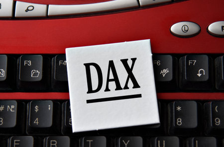 DAX - abbreviation on a white sheet against the background of a computer keyboard. internet conceptの写真素材