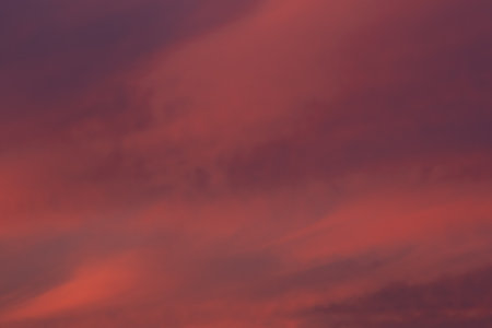 A fragment of a colorful sunset twilight sky. Burgundy and deep red