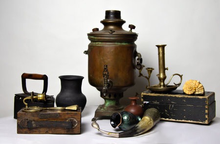 Still life from antiques. Samovar, iron, horn, box, bronze candlestick.