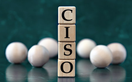 CISO (Chief Information Security Officer) - acronym on wooden cubes on a green background with wooden balls. Freedom of Information Act conceptの写真素材