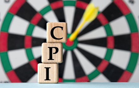 CPI - acronym on wooden cubes on dartboard background. Business and CPI, consumer price index concept.の写真素材