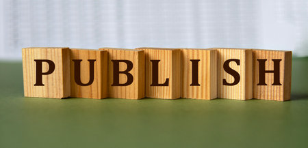 PUBLISH - word on wooden blocks on light backgroundの写真素材